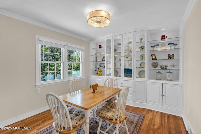 708 Schoolhouse Rd, Brielle, NJ 08730 - dining area with ornamental molding and light wood finished floors