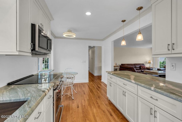 708 Schoolhouse Rd, Brielle, NJ 08730 - kitchen with appliances with stainless steel finishes, white cabinets, pendant lighting, light wood finished floors, and light stone countertops