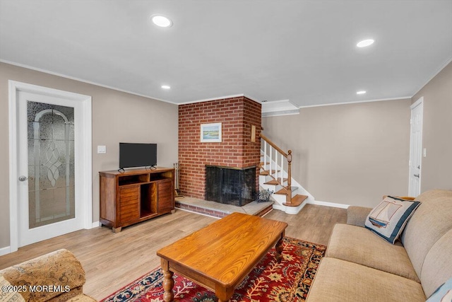 708 Schoolhouse Rd, Brielle, NJ 08730 - living area featuring crown molding, wood finished floors, a brick fireplace, recessed lighting, and stairway