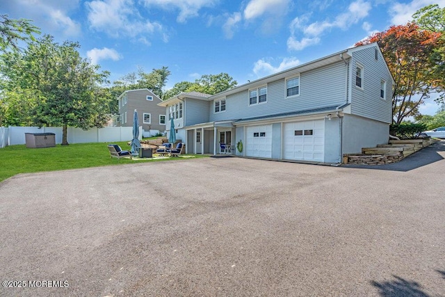 708 Schoolhouse Rd, Brielle, NJ 08730 - view of front facade featuring driveway and a garage