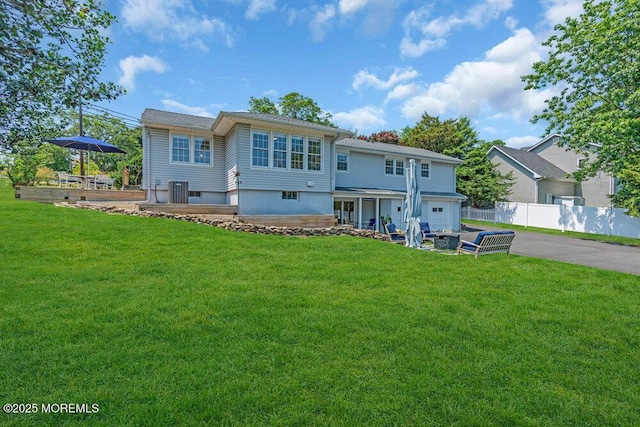 708 Schoolhouse Rd, Brielle, NJ 08730 - rear view of house with asphalt driveway, a garage, and a patio