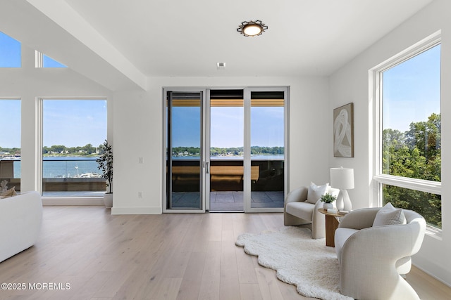 4 Boat Club Ct Unit 3E, Red Bank, NJ 07701 - sitting room featuring healthy amount of natural light, wood finished floors, and a water view