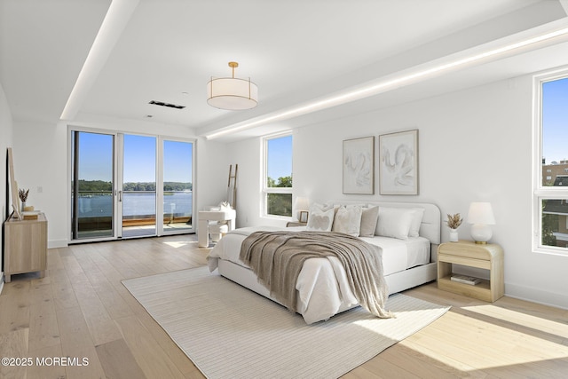 4 Boat Club Ct Unit 3E, Red Bank, NJ 07701 - bedroom featuring access to outside, light wood-style flooring, and a water view
