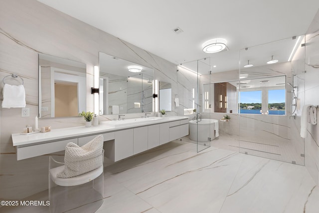 4 Boat Club Ct Unit 3E, Red Bank, NJ 07701 - full bath with a marble finish shower, double vanity, a water view, tile walls, and marble finish floors