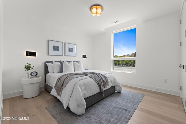 4 Boat Club Ct Unit 3E, Red Bank, NJ 07701 - bedroom featuring light wood-style flooring and baseboards