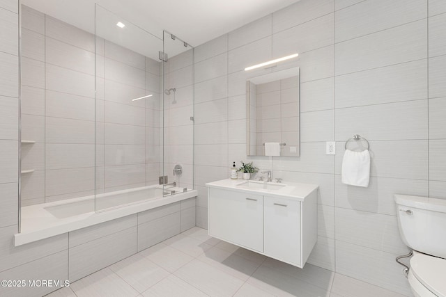 4 Boat Club Ct Unit 3E, Red Bank, NJ 07701 - bathroom featuring tile walls, tiled shower / bath combo, vanity, and tile patterned floors
