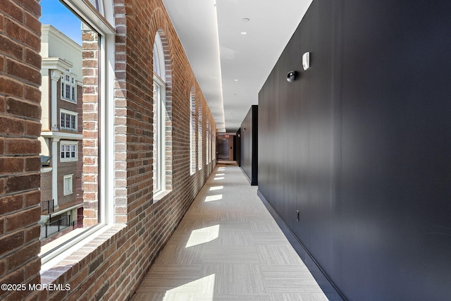 4 Boat Club Ct Unit 3E, Red Bank, NJ 07701 - hall with brick wall and carpet floors