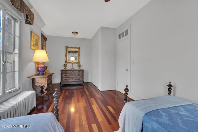 310 Cooper Rd Unit C, Red Bank, NJ 07701 - bedroom featuring radiator, multiple windows, and wood finished floors