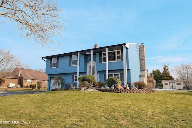 277 Grandview Ave, Piscataway Twp, NJ 08854 - view of front of house featuring a chimney, an attached garage, a front yard, and driveway