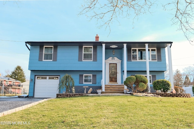 277 Grandview Ave, Piscataway Twp, NJ 08854 - split foyer home with driveway, a chimney, a front yard, and an attached garage