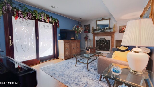 277 Grandview Ave, Piscataway Twp, NJ 08854 - living area featuring a fireplace with raised hearth