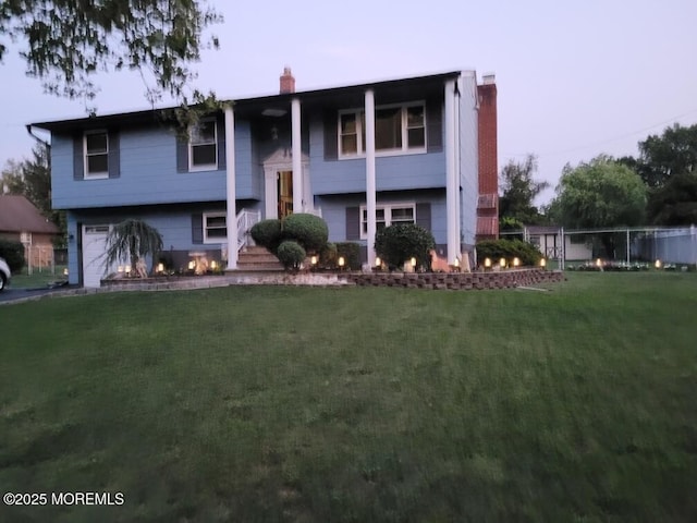 277 Grandview Ave, Piscataway Twp, NJ 08854 - bi-level home featuring a chimney and an attached garage