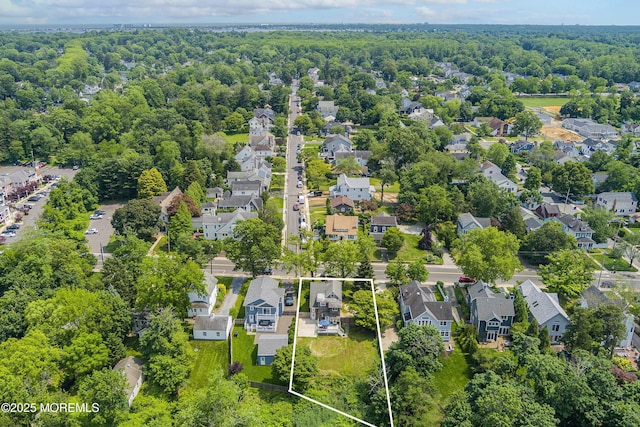 699 River Rd, Fair Haven, NJ 07704 - aerial perspective of suburban area featuring property parcel outlined and a heavily wooded area