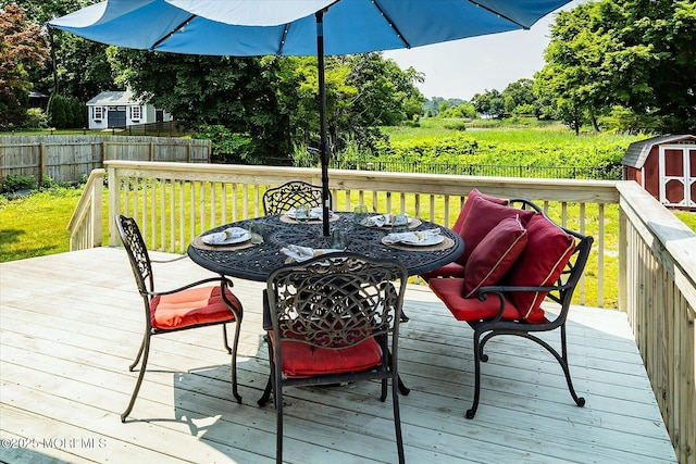 699 River Rd, Fair Haven, NJ 07704 - deck with a shed, outdoor dining area, and a fenced backyard