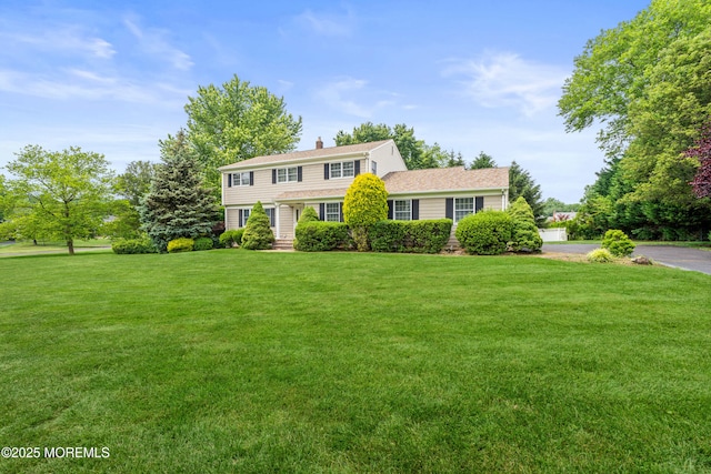 24 Sugar Maple Dr, Red Bank, NJ 07701 - view of front of property with a front lawn and a chimney