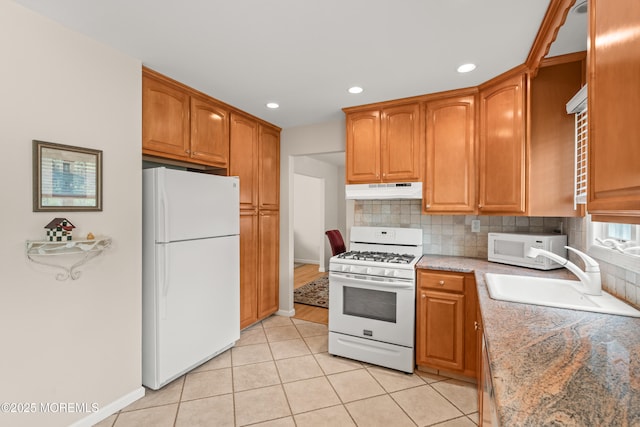 24 Sugar Maple Dr, Red Bank, NJ 07701 - kitchen with white appliances, under cabinet range hood, decorative backsplash, light tile patterned flooring, and recessed lighting