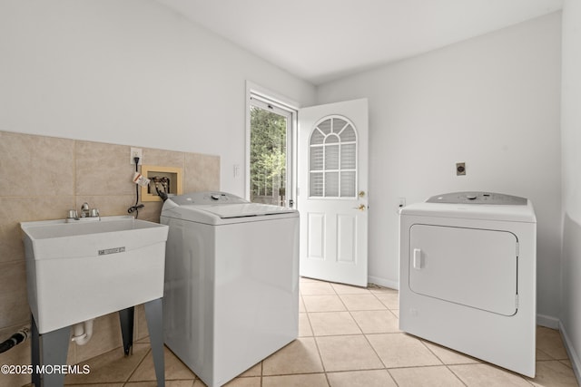 24 Sugar Maple Dr, Red Bank, NJ 07701 - laundry area with independent washer and dryer, light tile patterned floors, and tile walls