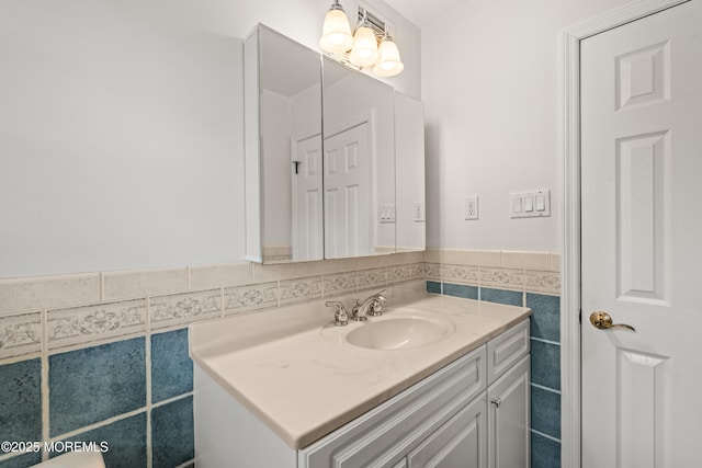 24 Sugar Maple Dr, Red Bank, NJ 07701 - bathroom featuring vanity, tile walls, and wainscoting