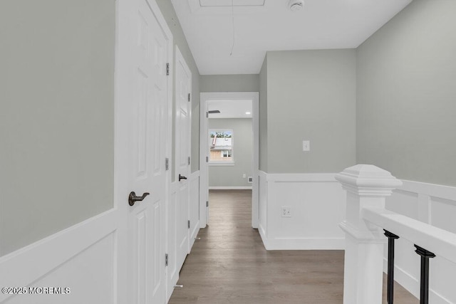 84 Briar Mills Dr, Brick, NJ 08724 - hallway with attic access, wainscoting, wood finished floors, and a decorative wall
