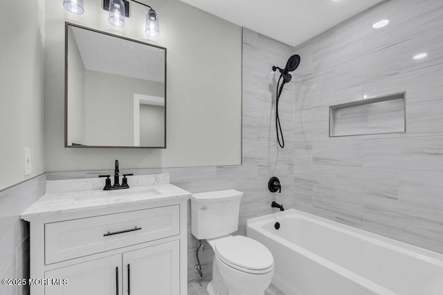 84 Briar Mills Dr, Brick, NJ 08724 - bathroom featuring toilet, vanity, shower / washtub combination, and tile walls