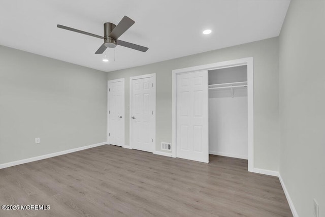 84 Briar Mills Dr, Brick, NJ 08724 - unfurnished bedroom with baseboards, wood finished floors, recessed lighting, ceiling fan, and two closets