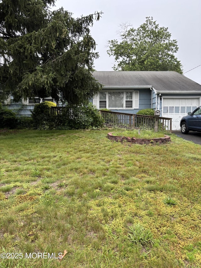 321 Green Tree Rd, Brick, NJ 08724 - view of front of home featuring an attached garage, a front lawn, asphalt driveway, and roof with shingles