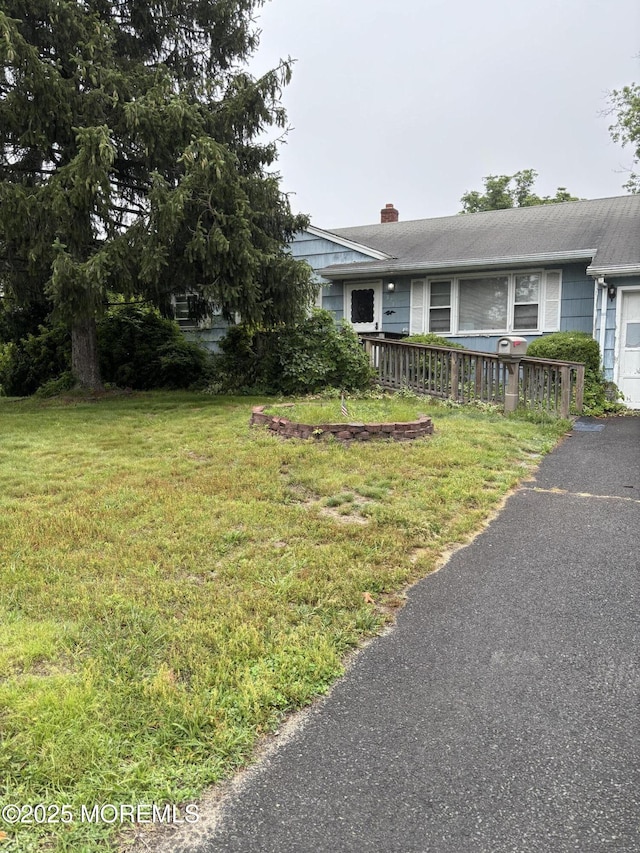 321 Green Tree Rd, Brick, NJ 08724 - view of front of home with a chimney and a front yard