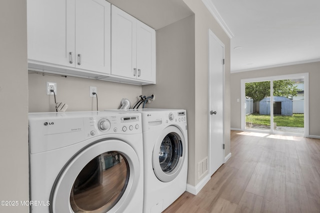 34-1 Green Grove Ave, Keyport, NJ 07735 - laundry room with cabinet space, washing machine and dryer, light wood finished floors, and ornamental molding