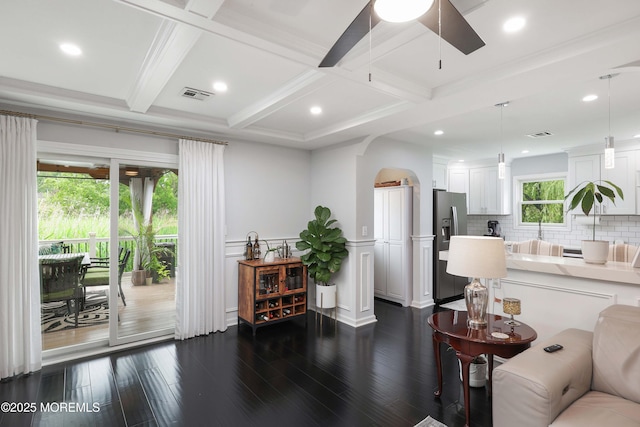 8 Clement Ln, Leonardo, NJ 07737 - living area featuring coffered ceiling, dark wood finished floors, beamed ceiling, arched walkways, and a ceiling fan