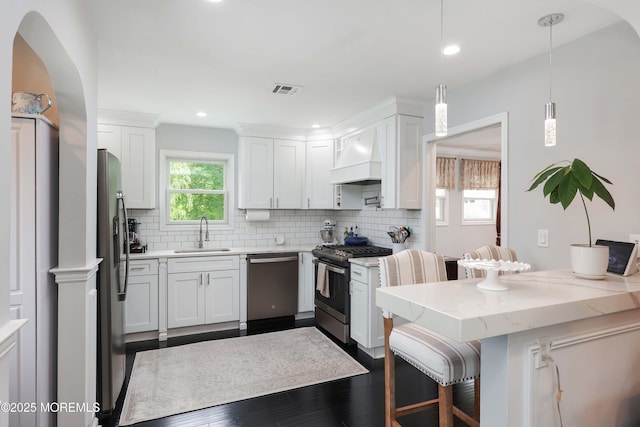 8 Clement Ln, Leonardo, NJ 07737 - kitchen featuring stainless steel appliances, custom range hood, backsplash, dark wood-type flooring, and white cabinetry