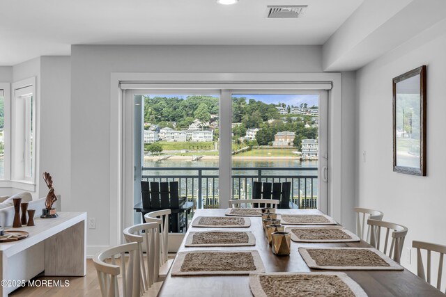 150 Ocean Ave Unit 6, Sea Bright, NJ 07760 - dining space with wood finished floors, a water view, and recessed lighting
