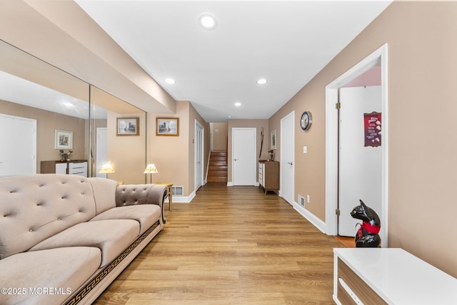 35 Lone Star Ln, Manalapan, NJ 07726 - living room with recessed lighting, light wood finished floors, baseboards, and stairway