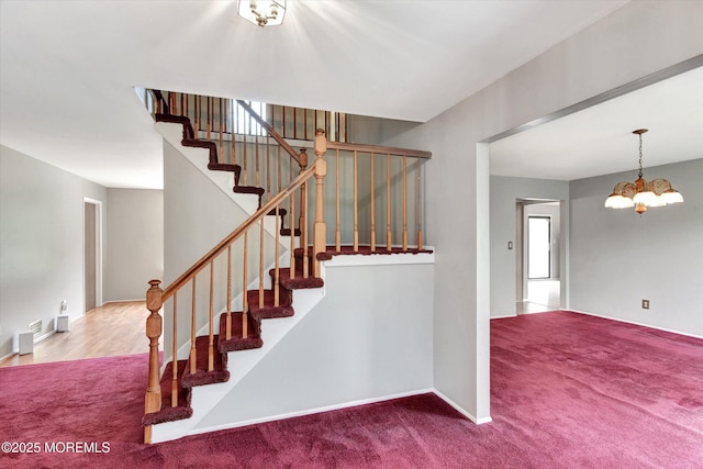 19 Northwoods Rd, Ocean Twp, NJ 07712 - stairs featuring carpet floors and a chandelier