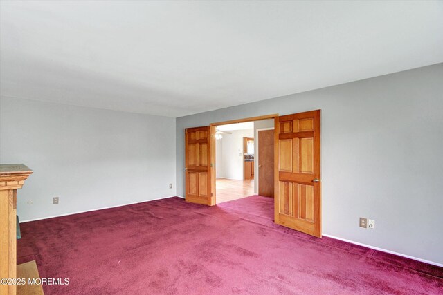 19 Northwoods Rd, Ocean Twp, NJ 07712 - empty room with carpet floors and ceiling fan