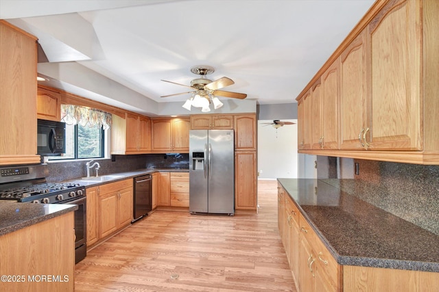 19 Northwoods Rd, Ocean Twp, NJ 07712 - kitchen featuring black appliances, ceiling fan, light wood-style floors, tasteful backsplash, and dark stone countertops