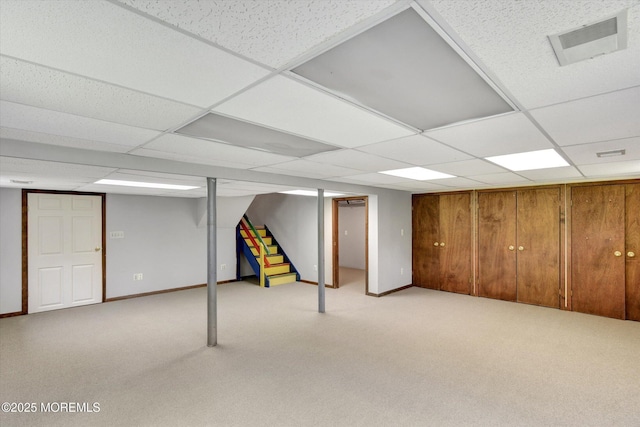 19 Northwoods Rd, Ocean Twp, NJ 07712 - finished basement with stairs, light carpet, and a paneled ceiling