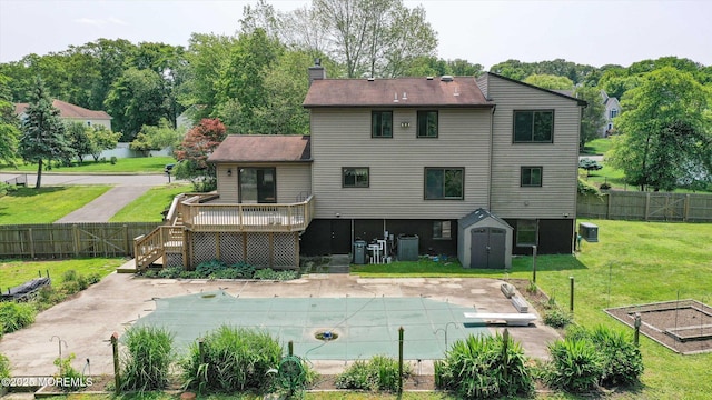 19 Northwoods Rd, Ocean Twp, NJ 07712 - back of property featuring a wooden deck, a fenced backyard, stairs, and a storage unit