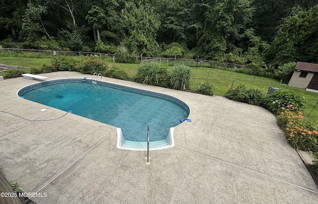 19 Northwoods Rd, Ocean Twp, NJ 07712 - view of pool with a patio, an outdoor structure, a diving board, and a view of trees