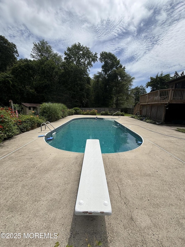 19 Northwoods Rd, Ocean Twp, NJ 07712 - outdoor pool with a diving board and a patio area