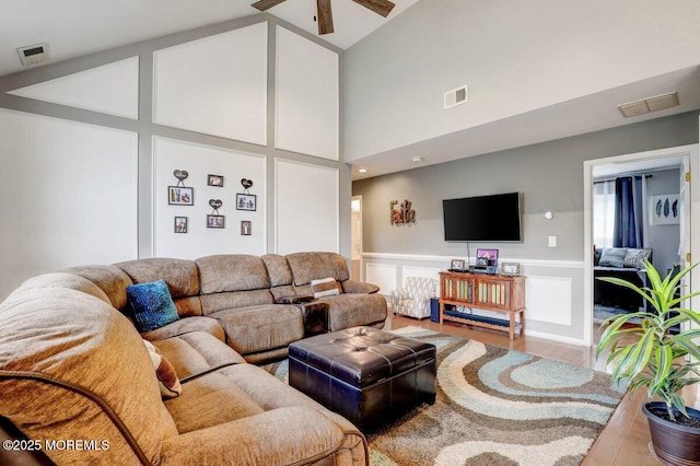 3 Kindling Way, Jackson, NJ 08527 - living area featuring wood finished floors, ceiling fan, high vaulted ceiling, a decorative wall, and a wainscoted wall