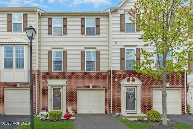 9 Olivia Dr, Tinton Falls, NJ 07712 - view of property with driveway and brick siding