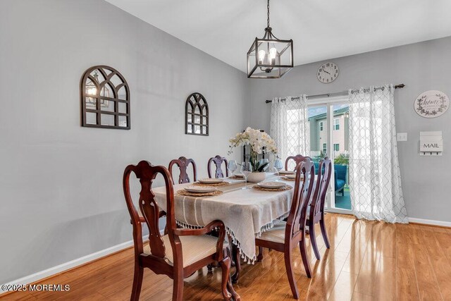 9 Olivia Dr, Tinton Falls, NJ 07712 - dining space featuring a chandelier and light wood-style flooring