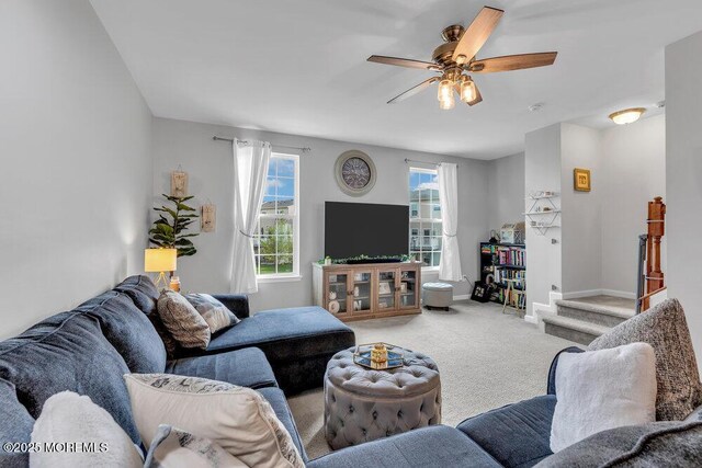 9 Olivia Dr, Tinton Falls, NJ 07712 - living area featuring carpet flooring, a ceiling fan, and stairway