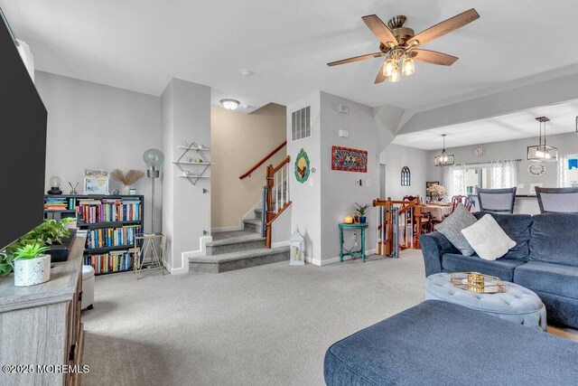 9 Olivia Dr, Tinton Falls, NJ 07712 - living area with carpet floors, ceiling fan, and stairs