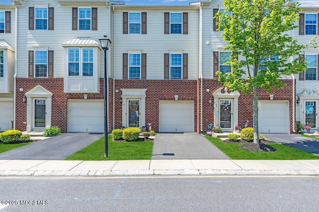 9 Olivia Dr, Tinton Falls, NJ 07712 - townhome / multi-family property featuring brick siding and driveway