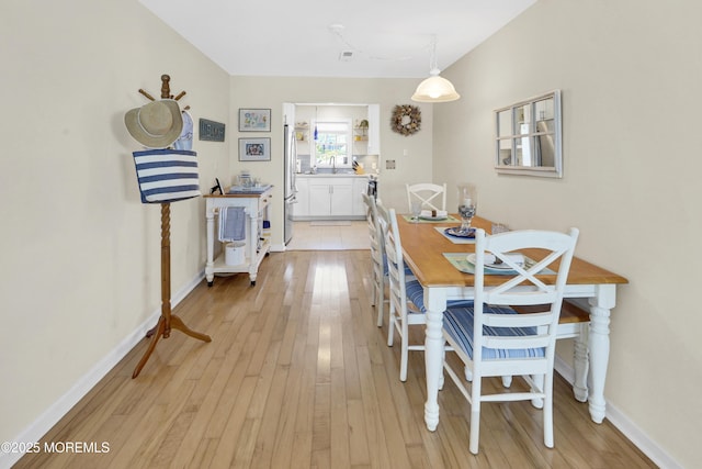 310 S W Ave Unit K1, Beach Haven, NJ 08008 - dining area with light wood-style floors