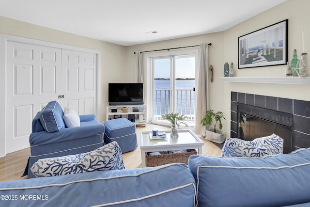 310 S W Ave Unit K1, Beach Haven, NJ 08008 - living area with wood finished floors and a tiled fireplace