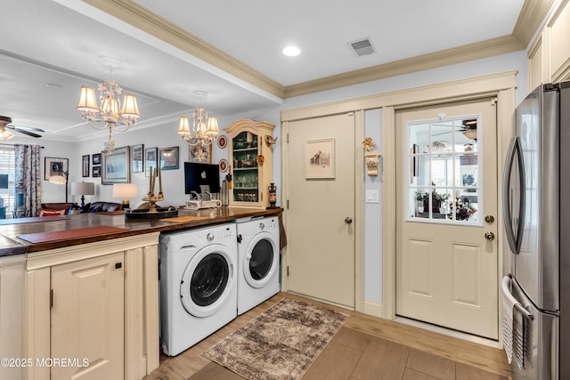 75 Farnworth Close Unit 1000, Freehold, NJ 07728 - laundry area with a chandelier, separate washer and dryer, ornamental molding, ceiling fan, and light wood-type flooring