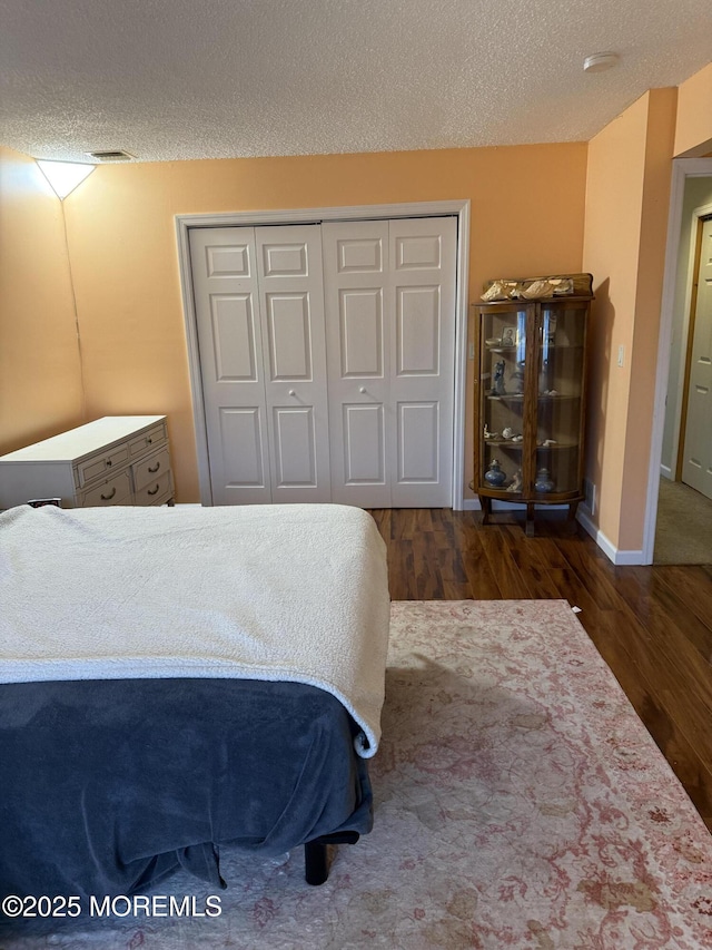 300 Allenhurst Ave, Neptune Township, NJ 07753 - bedroom with wood finished floors, a closet, and a textured ceiling
