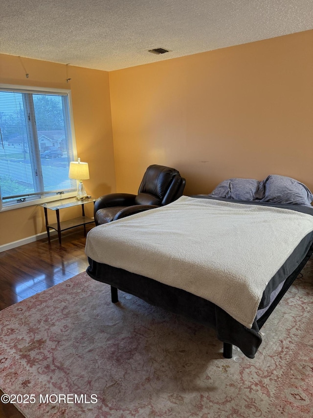 300 Allenhurst Ave, Neptune Township, NJ 07753 - bedroom with wood finished floors and a textured ceiling